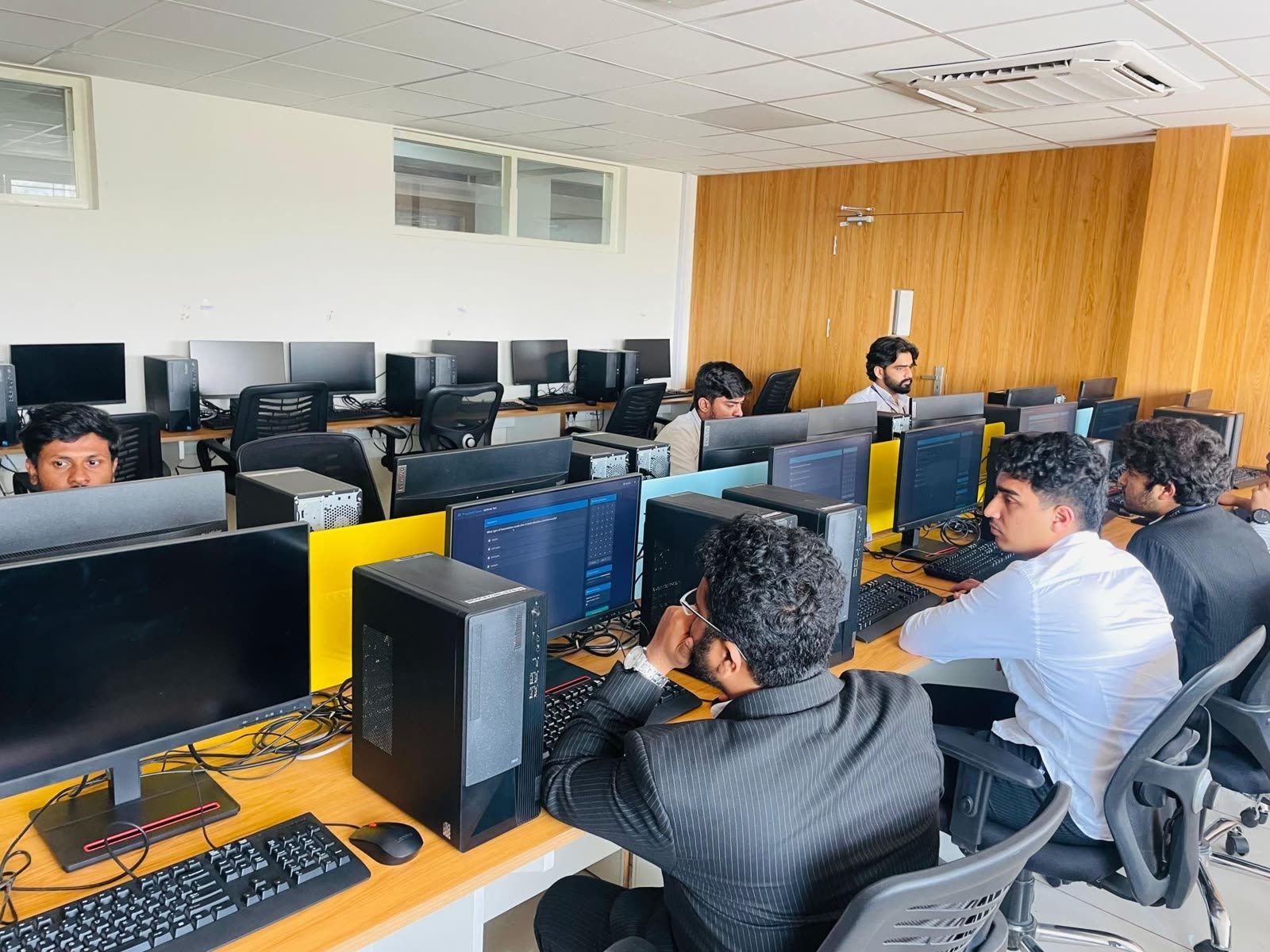 Prepzer0 exam interface running across lab workstations during a campus placement drive