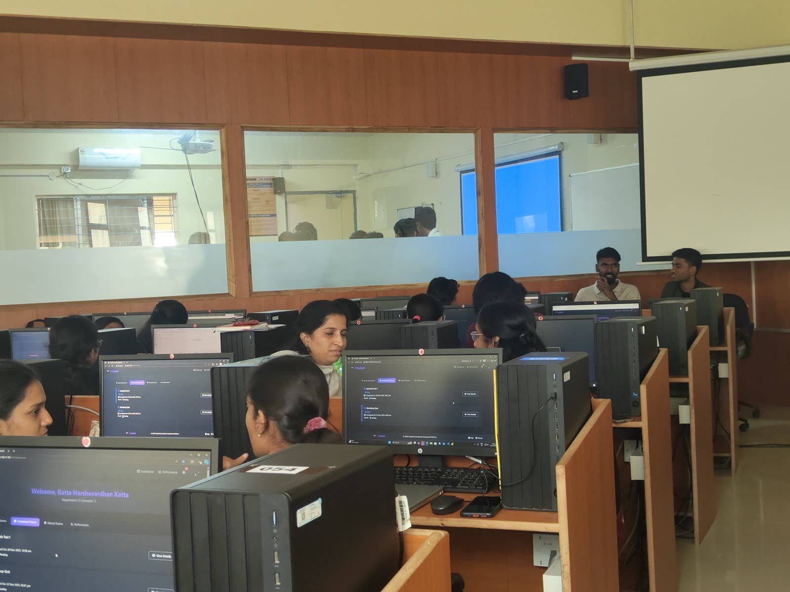 Students working through hands-on coding exercises at their workstations